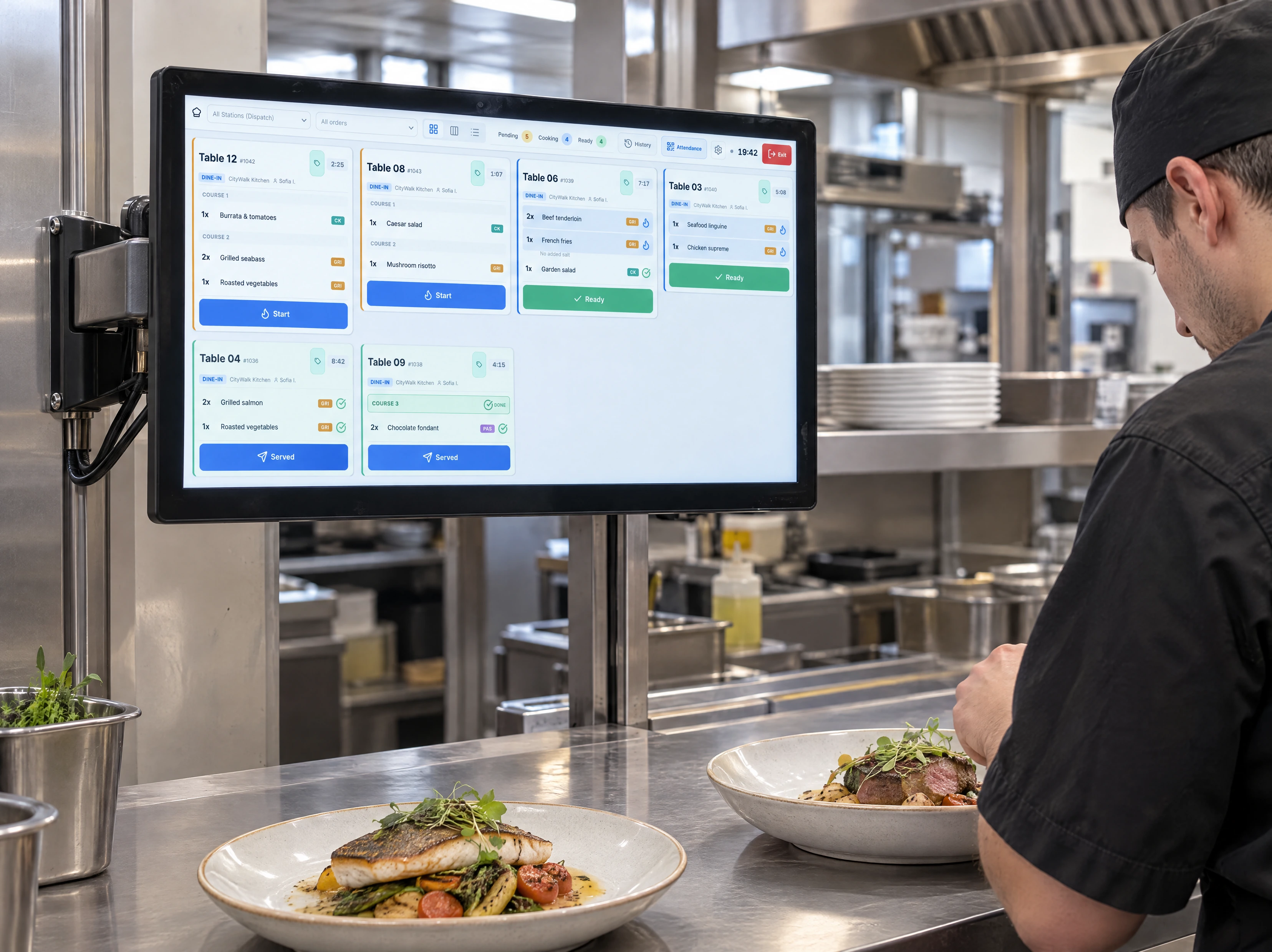 HoreX KDS compact order grid on a mounted kitchen touchscreen, seen at an angle beside the pass